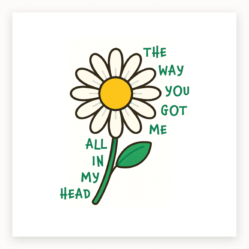 The card lying flat. Card with a daisy flower and the text 'THE WAY YOU GOT ME ALL IN MY HEAD', featuring a yellow centre and green leaves.
