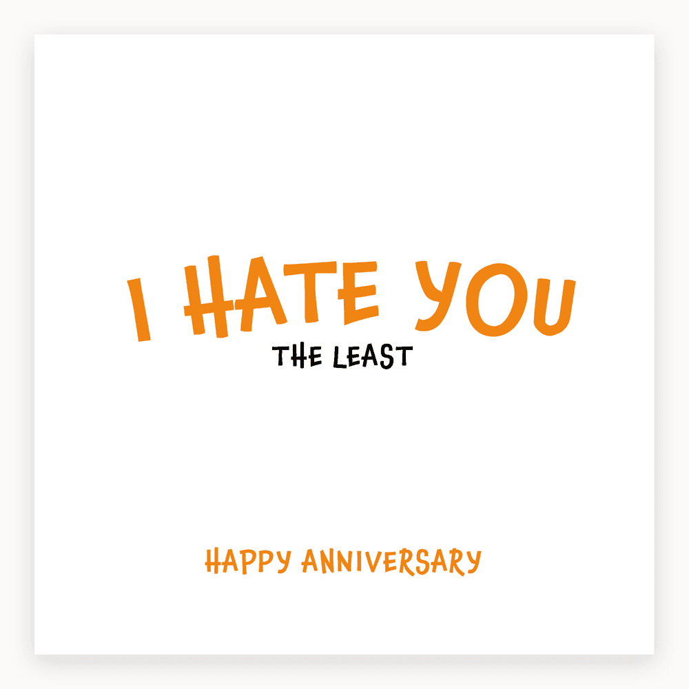 The card lying flat. Anniversary card with bold text 'I HATE YOU THE LEAST' in orange and black, 'HAPPY ANNIVERSARY' in orange below.