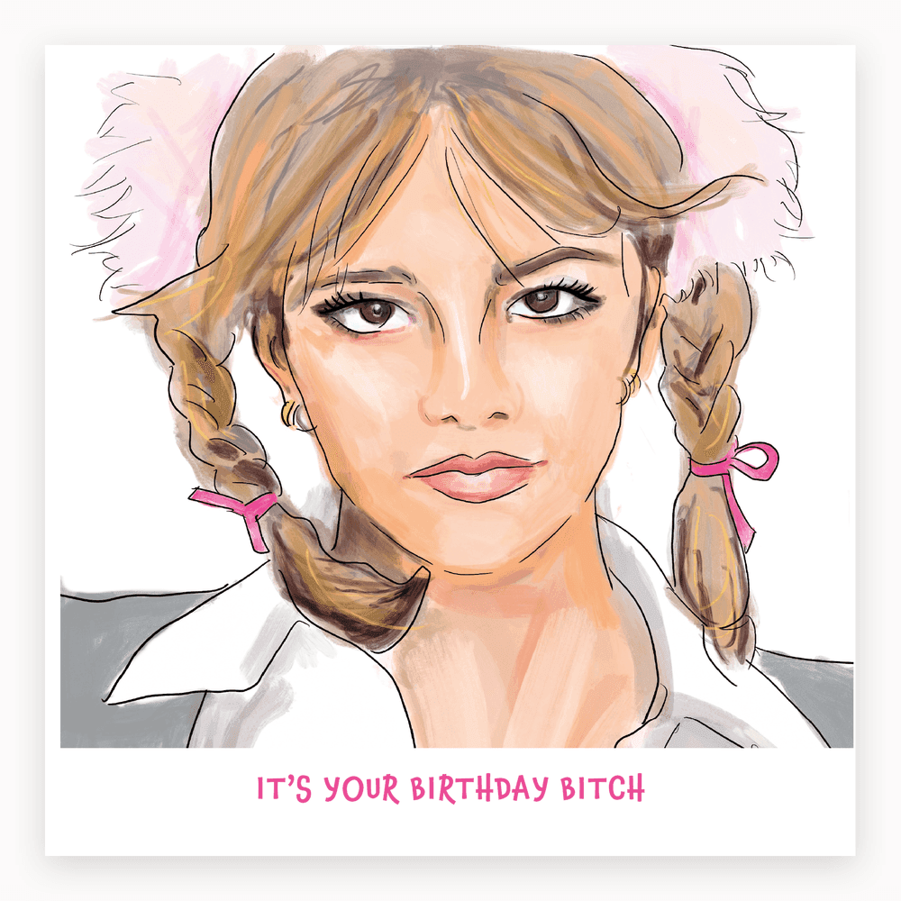 The card lying flat. Card with illustration of a woman in pigtails and schoolgirl outfit, text reads 'IT'S YOUR BIRTHDAY BITCH'. Predominantly pink and white.
